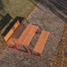 Gewerbefabrik Tisch Arnshausen Holz Outdoor Stadtmobiliar Rot RAL 3001 Szene